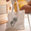 Paradiso Palm Tote in White – woven embroidered palm tote with water bottle holder